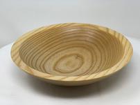 Shallow wooden bowl with tree ring pattern 202//152