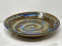 Large shallow bowl with spiral design with raw exterior 202//152