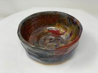 Ceramic bowl with earthy shades of browns,reds & blues 202//152