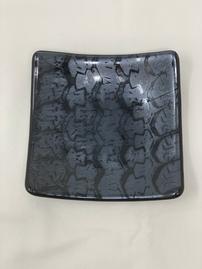 Black glass plate with irridescent tire pattern 202//269