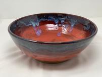 Large ceramic serving bowl in shades of red, blue and snow 202//152
