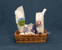 Small basket with beer glasses, corkscrew, dishtowels 202//162