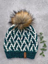 Hand knit hat with fur poof in 100% wool, Jebbie Stadium, in green and white 202//269