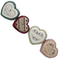 Four handmade cross stitched puffy hearts each with a silver charm 202//202