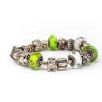 Pandora bracelet with silver, green and white charms 202//202