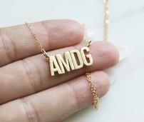 AMDG necklace on a 16in -18in adjustable chain. The chain is gold-filled and the 202//171