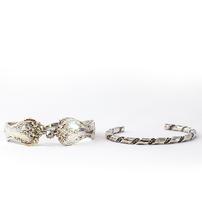 Two silver bracelets: double spoon ends, and a twisted silver band 202//202
