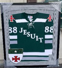 Strake Jesuit Crusader hockey jersey from the inaugural season, framed 202//223